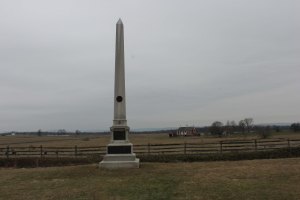 The monument marking the July 3 position of the 1st Minnesota.  The raised line of ground in front of the monument marks the breastwork the regiment threw up on the morning of July 3.  The Nicholas Codori farm is in the middle distance beside the Emmitsburg Road.  NPS